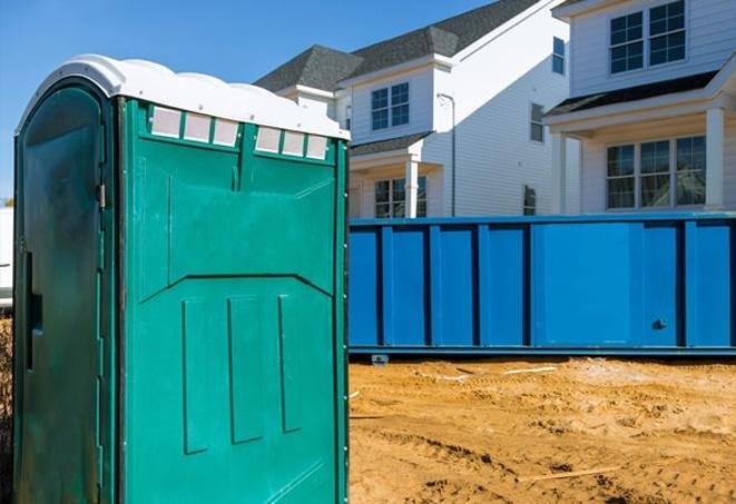 a lineup of clean and well-maintained portable loos for workers